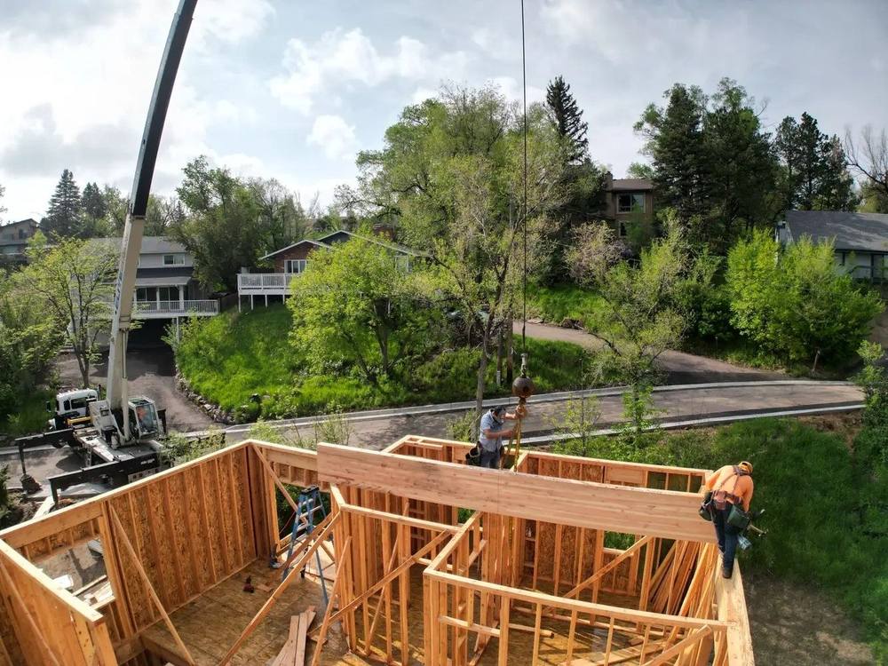 Setting timber framing on a custom mountain home in Colorado
